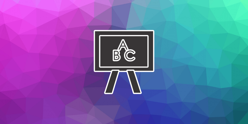 ABC on blackboard with a multicoloured polygon background